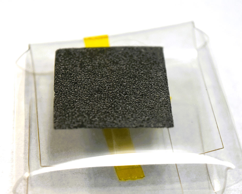 Freestanding 3D graphene foam in case, etched for top energy, biosensor applications.