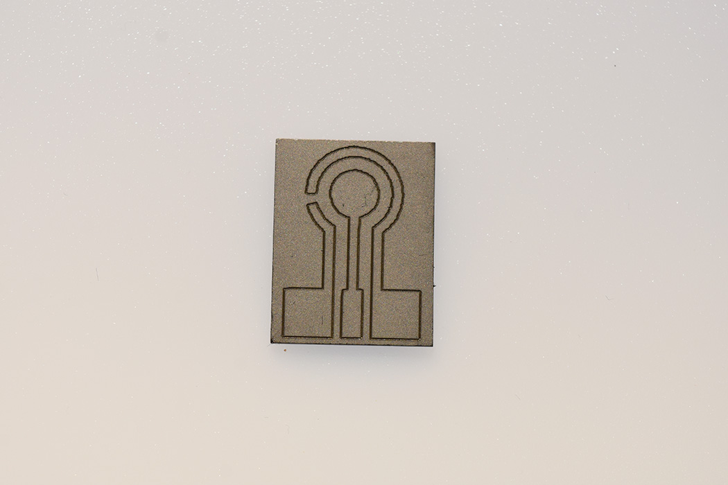 Metal key representing CVD tech for carbon films: A symbol of graphene innovation.