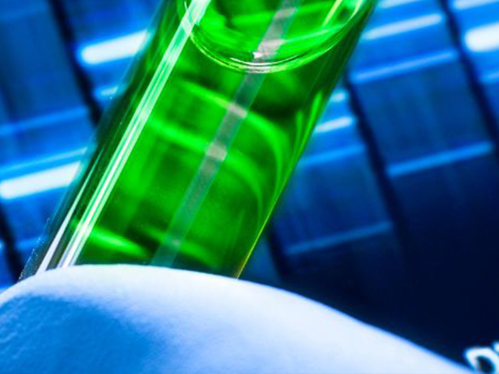 Green liquid in tube for biosensing device development with advanced graphene technology.