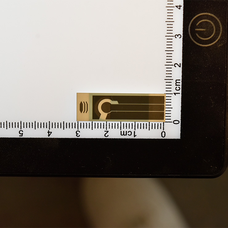 Key-shaped secure access sticker from pyrolytic carbon, made with superior CVD by top graphene firm.